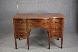 Sideboard, late Georgian mahogany serpentine fronted with brass rail. H.129 W.136 D.73cm.