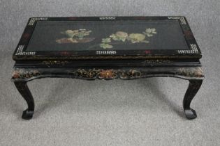 A Chinese style coffee table with carved soapstone floral decoration and inlaid mother of pearl
