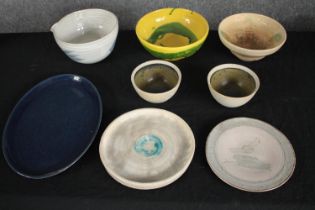 A collection of five bowls and three plates in various glazes, some signed on the base. H.32 W.23cm.