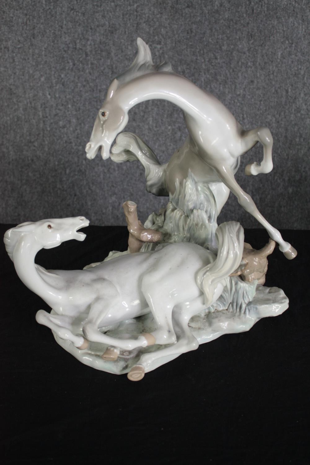 A large Lladro figure group of two white horses. Modelled on a rocky landscape. Along with a metal - Image 6 of 9