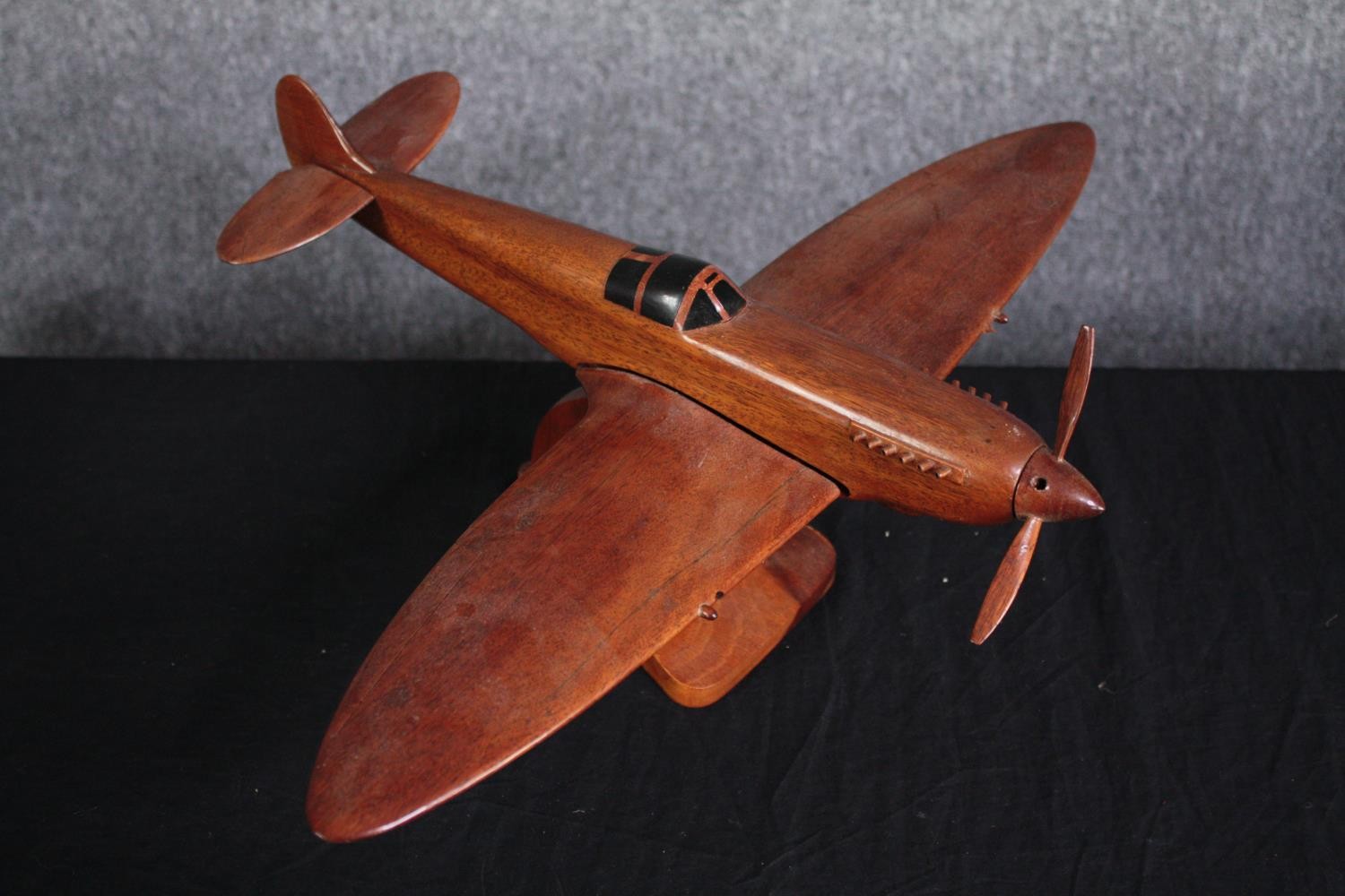 A large carved Supermarine Spitfire. Desk model. Missing one blade to its propeller and one - Image 3 of 4