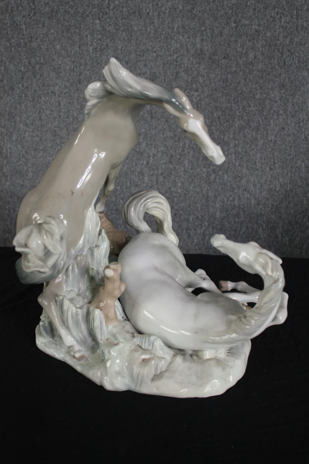 A large Lladro figure group of two white horses. Modelled on a rocky landscape. Along with a metal - Image 7 of 9