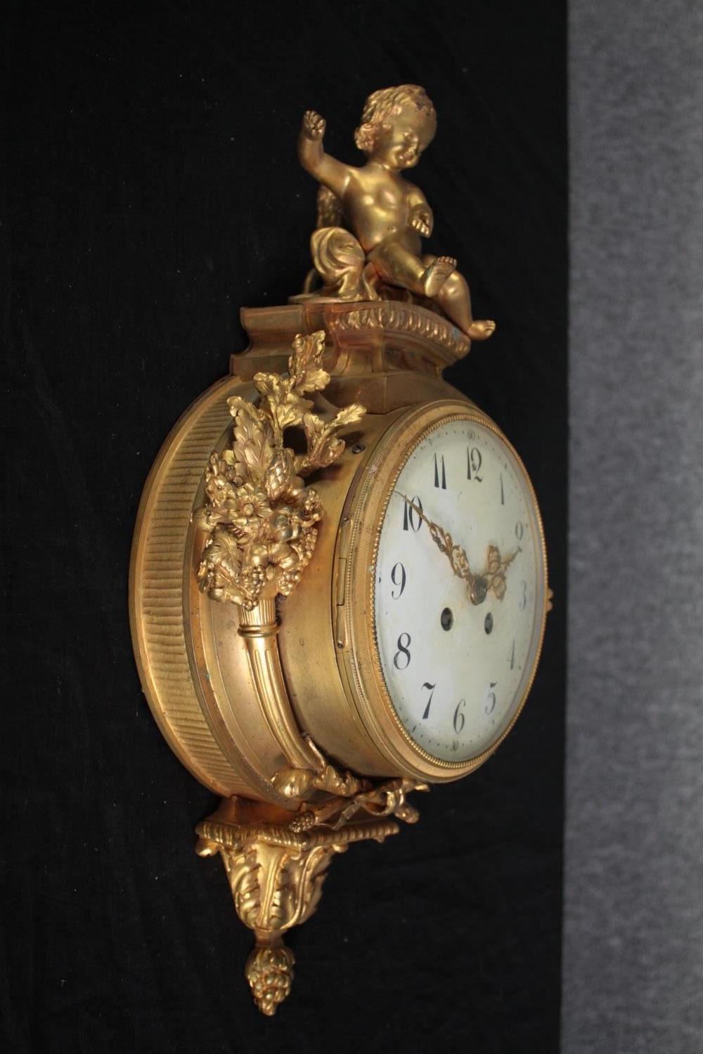 A Rococo cartel style gilt metal clock mounted with a cherub. H.46 W.27cm. - Image 2 of 7