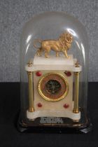 A nineteenth century French gilt metal and marble glass domed mantle clock. H.45 W.30 D.20 cm.
