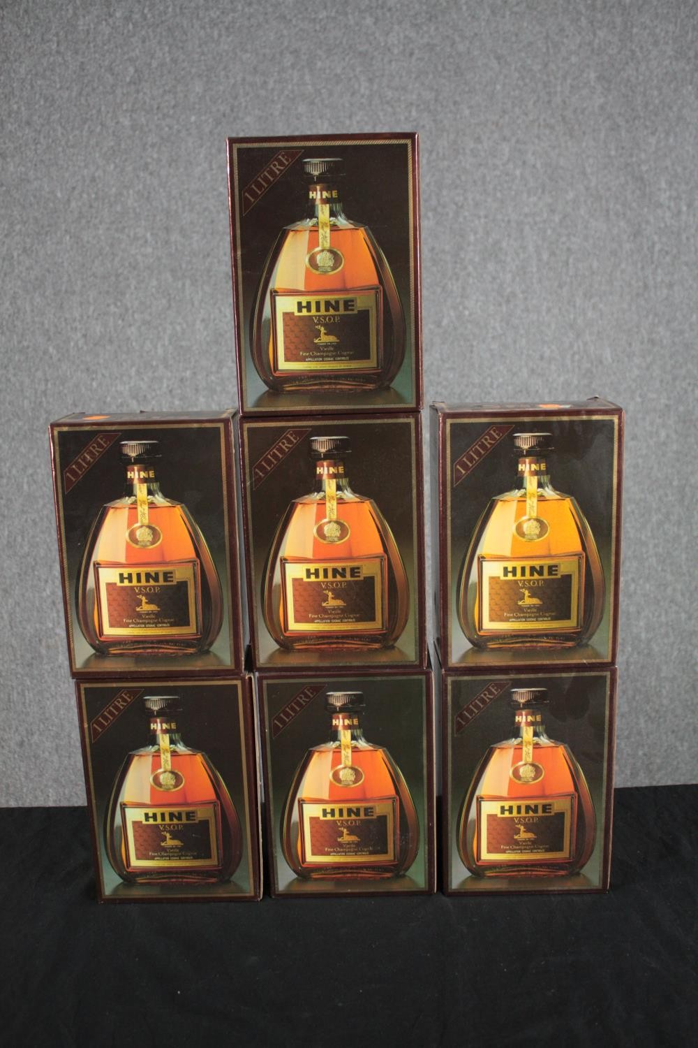 Seven bottles of V.S.O.P Hine cognac. Boxed and unopened one litre bottles.