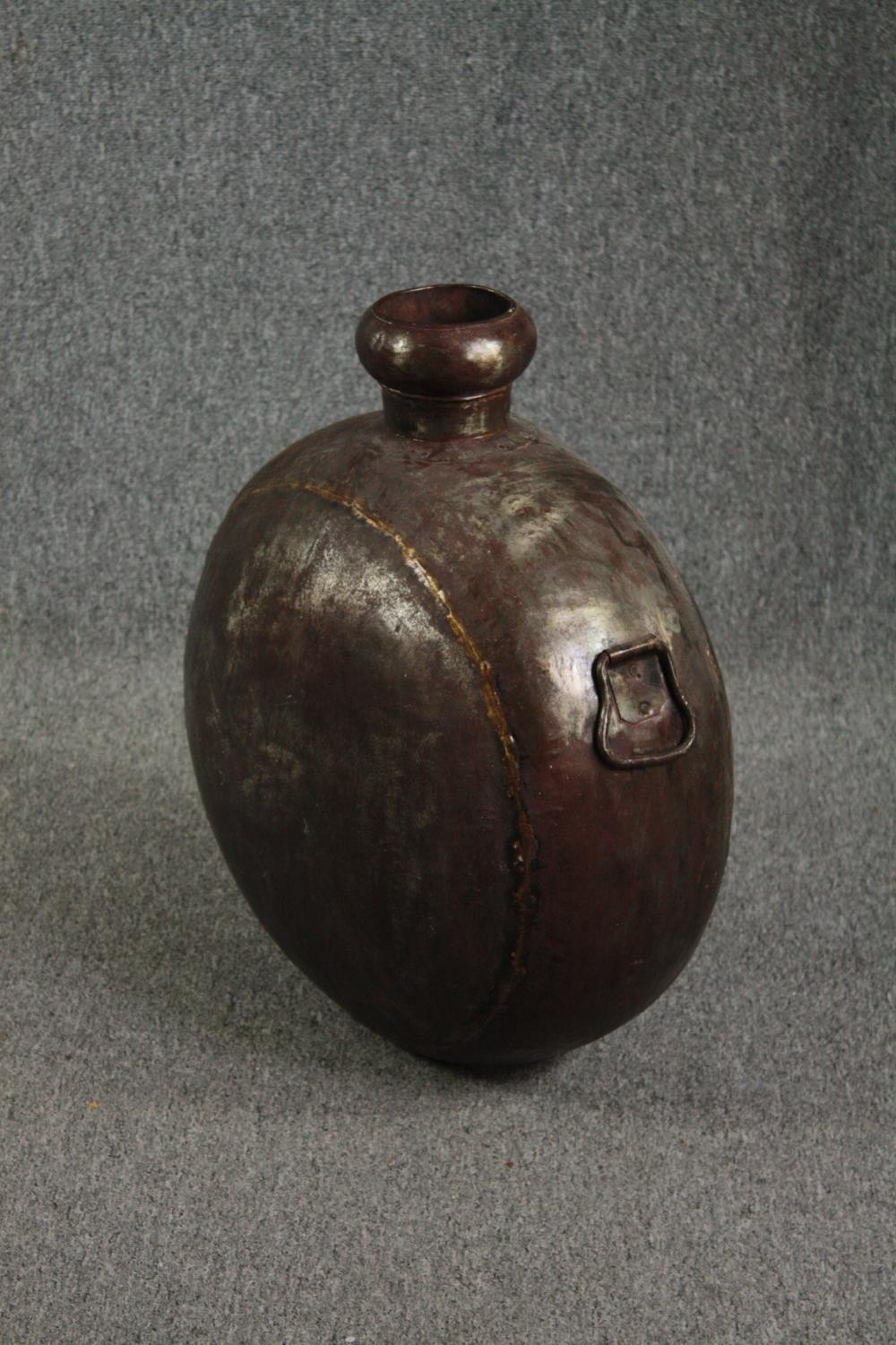A brass flask. Probably late nineteenth century. H.61 W.52cm. - Image 2 of 4
