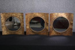 A set of three contemporary metal convex framed mirrors. H.40 W.40cm.(each)