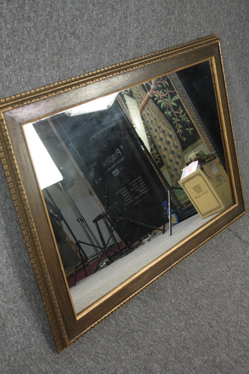 A contemporary gilt framed wall mirror. H.78 W.108cm. - Image 3 of 4