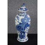 A hand painted lidded Chinese pot decorated with dragons. Stamped with the artist's seal on the