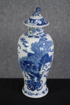 A hand painted lidded Chinese pot decorated with dragons. Stamped with the artist's seal on the