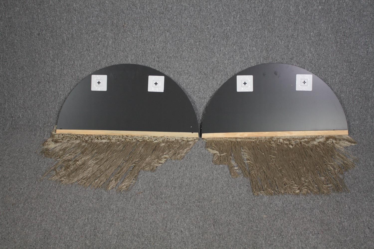 A pair of arched contemporary mirrors with tassle fringed bases. H.40 W.80cm. (each) - Image 3 of 3