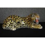 A hand painted ceramic Leopard. 'Made in Italy'. L.45cm.