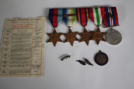 A collection of WWII medals with oak leaves. Including the Burma Star, Italy Star, 1939-1945 Star