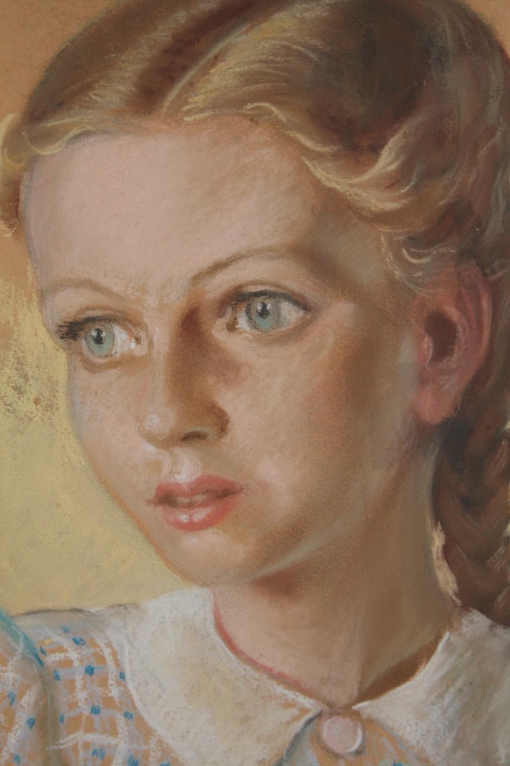 A pastel portrait of a girl. Dated 1943 and signed indistinctly bottom right. Framed and glazed. H.