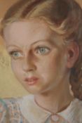A pastel portrait of a girl. Dated 1943 and signed indistinctly bottom right. Framed and glazed. H.