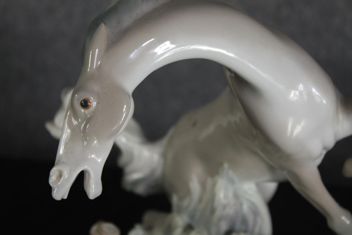 A large Lladro figure group of two white horses. Modelled on a rocky landscape. Along with a metal - Image 8 of 9
