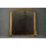 A 19th century carved giltwood overmantel mirror with it's original plate. H.95 W.89cm.