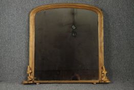 A 19th century carved giltwood overmantel mirror with it's original plate. H.95 W.89cm.