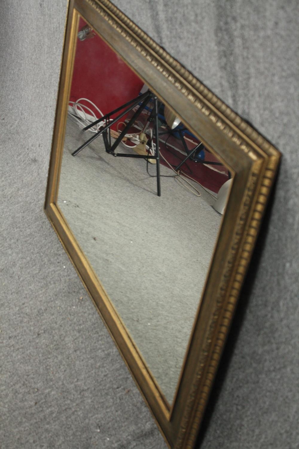 A contemporary gilt framed wall mirror. H.78 W.108cm. - Image 2 of 4