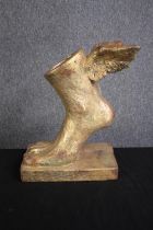 A modern winged foot in the style of Michael Alfano. Resin. Twentieth century. H.40 W.30 D.18cm.