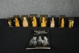 Chess. A collection of Lewis chessmen. Including the King and Queen, Knights, pawns and a rook.