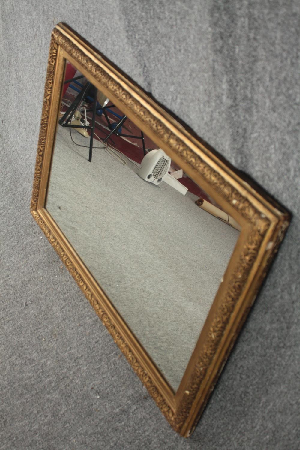 A 19th century gilt and gesso framed wall mirror with replacement plate. H.65 W.90cm. - Image 3 of 4