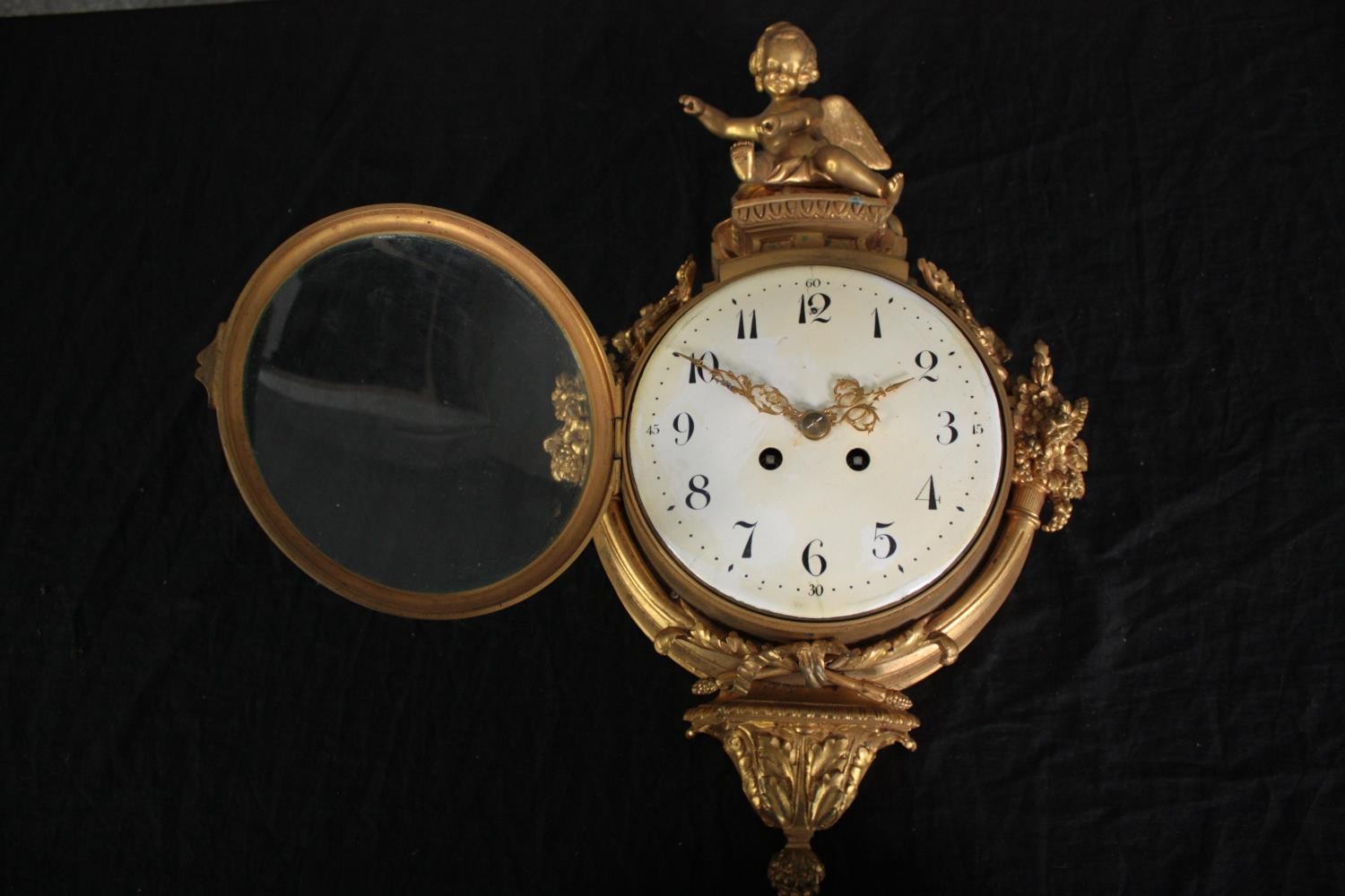 A Rococo cartel style gilt metal clock mounted with a cherub. H.46 W.27cm. - Image 5 of 7