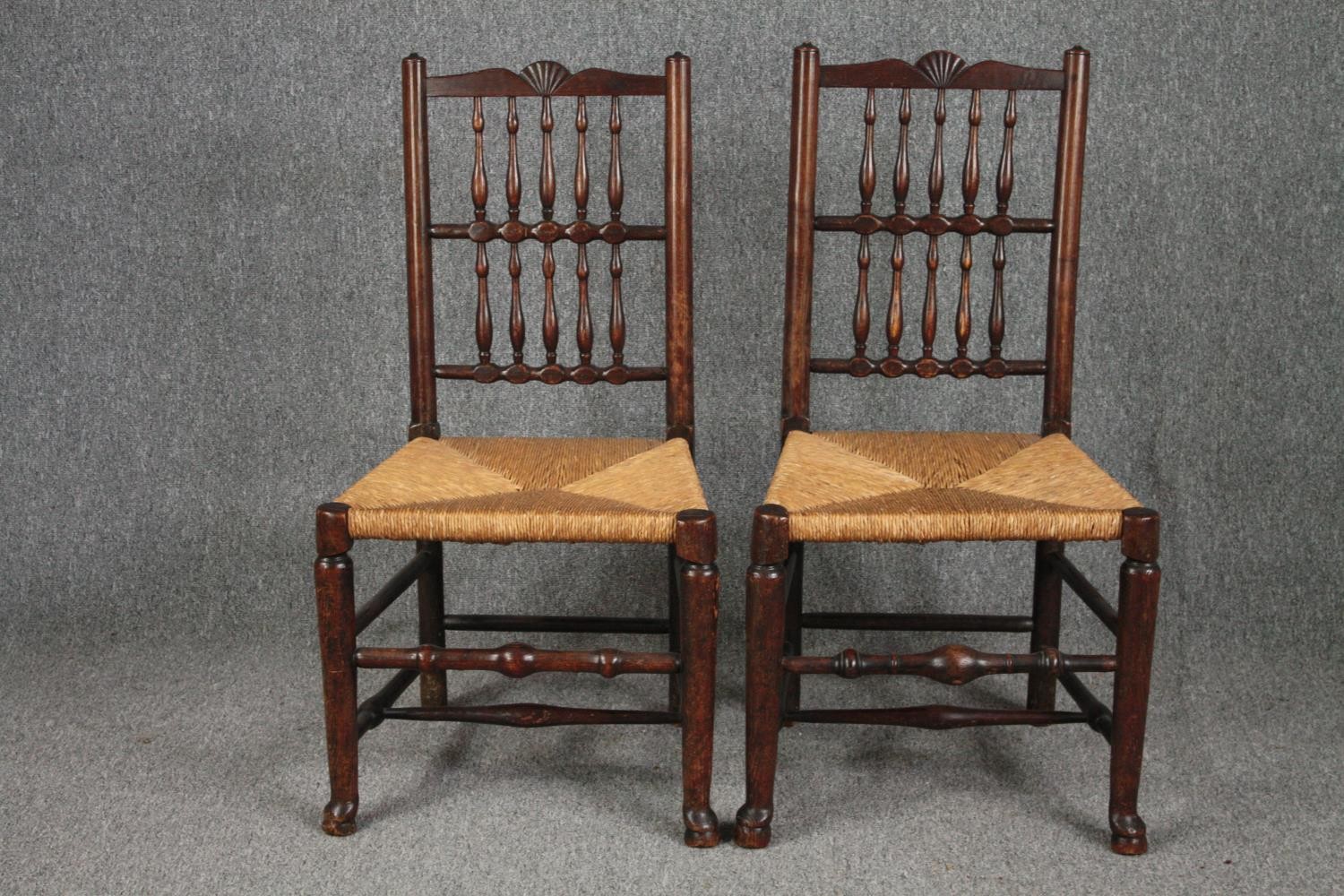 Dining chairs, a pair of early 19th century Lancashire style spindle back in elm and oak.