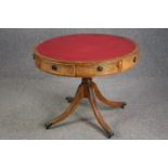 A Georgian style mahogany library drum table. H.72 Dia.92cm.