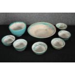 A collection of seven glazed bowls in a greenish teal. Dia.23cm. (largest)