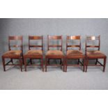 A harlequin set of five 19th century mahogany and satinwood bar back dining chairs.