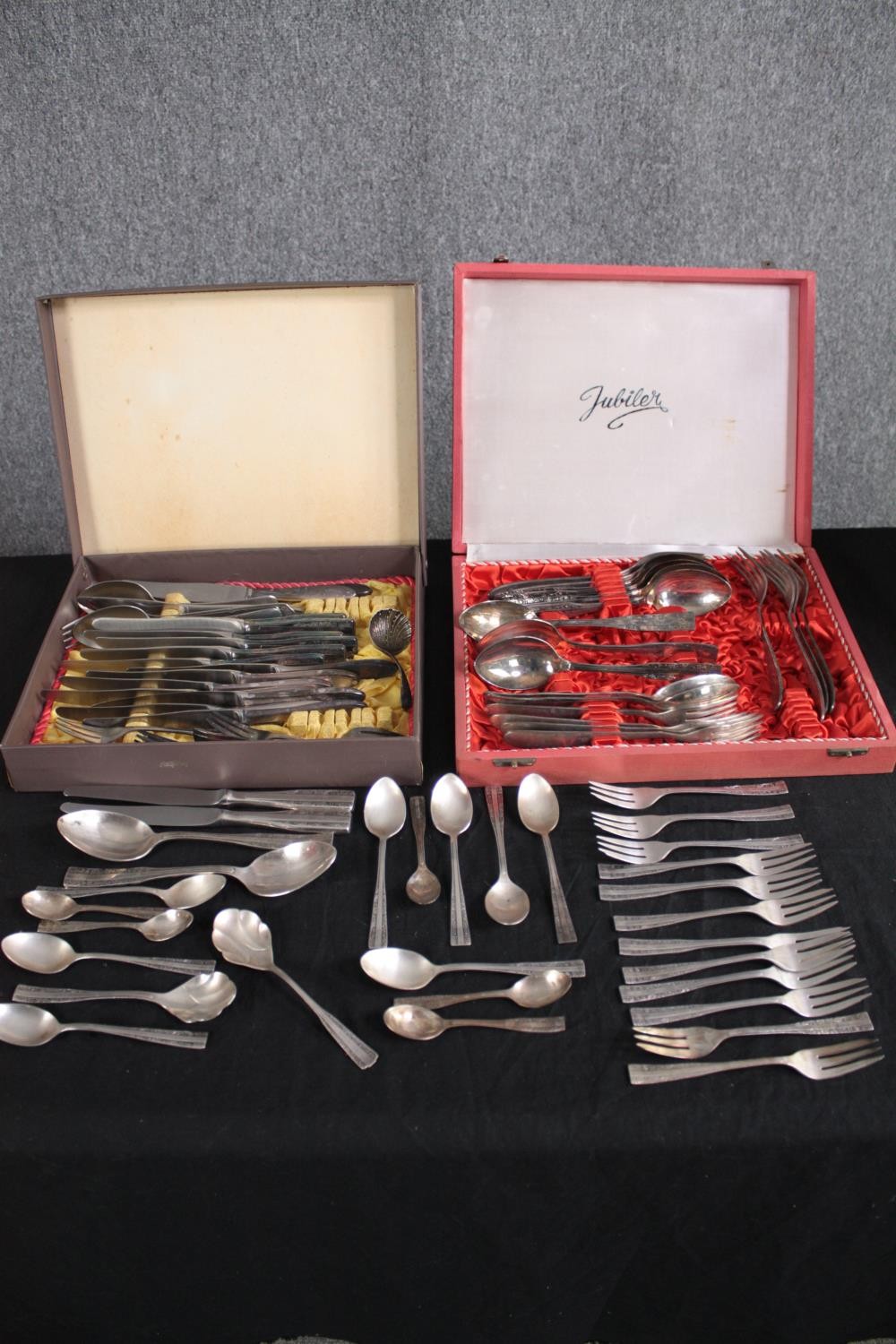 Three sets of cutlery. One loose and two boxed. Sheffield plate. One set contains scalloped spoons