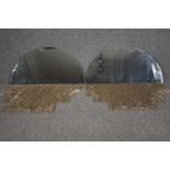 A pair of arched contemporary mirrors with tassle fringed bases. H.40 W.80cm. (each)