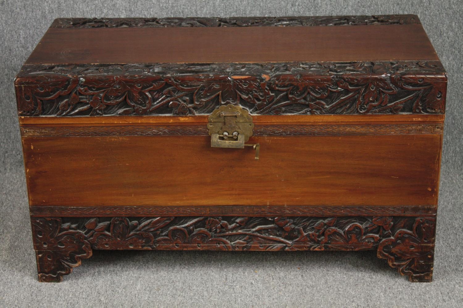 Coffer, early 20th century Chinese carved camphorwood. H.58 W.104 D.52cm.