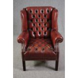 Wing armchair, Georgian style deep buttoned leather upholstery.