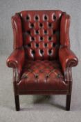 Wing armchair, Georgian style deep buttoned leather upholstery.