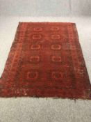 An old Eastern carpet, worn. L.202 W.147cm.