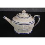 Castleford teapot. Circa 1810. Decorated with an arcade of classical scenes of figures. White and