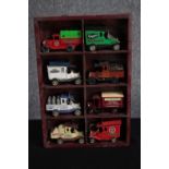 Oxford Diecast. A collection of eight 'vintage model' cars. In a wooden display case. H.31 W.