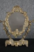 A vintage brass framed Rococo style vanity mirror. H.36 W.31cm.