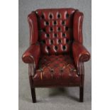 Wing back armchair, Georgian style deep buttoned leather upholstered. H.96cm. (Some wear as seen).