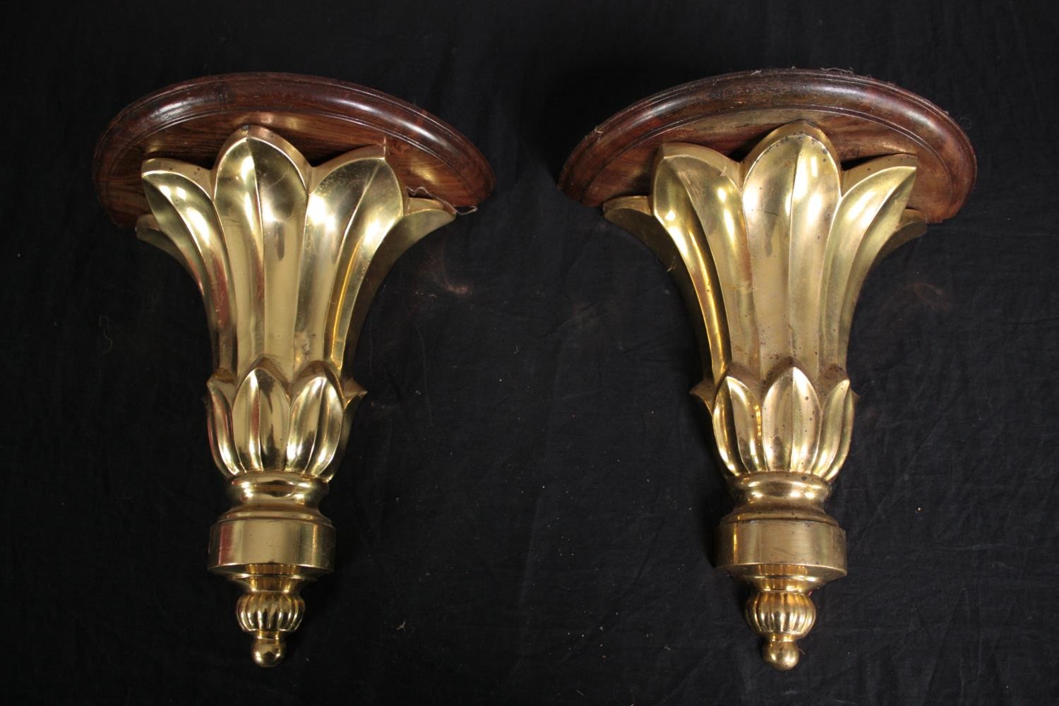 Two moulded gilt wall sconces. H.31cm. (each)