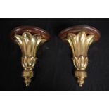 Two moulded gilt wall sconces. H.31cm. (each)