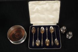 A collection of silver, including a silver and oak wine coaster, a cased set of silver tea spoons