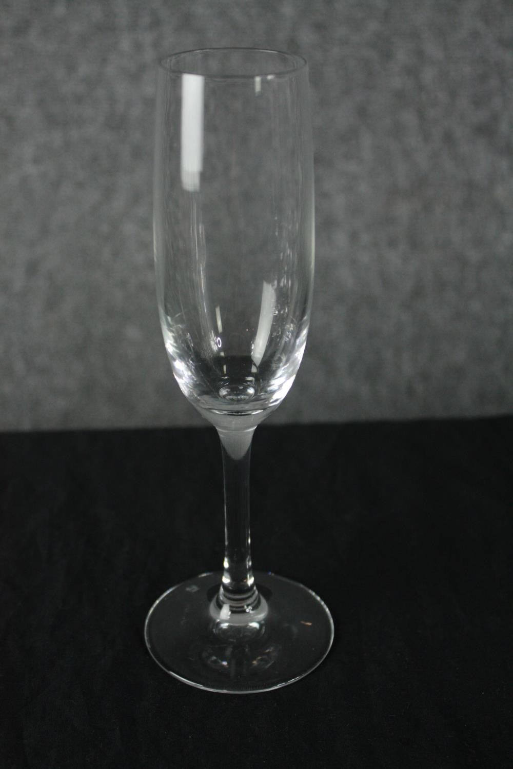 A collection of twenty-two Champagne glasses, one set by Dartington. H.23cm. (largest) - Image 4 of 4