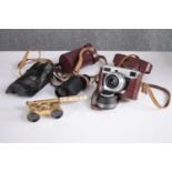 A Werra Camera, monocular and opera glasses. A cased collection. H.14 W.10cm. (largest)