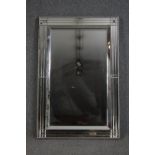 Wall mirror, contemporary with bevelled plate in glazed frame. H.120 W.80cm.