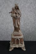 Bronze spelter figure. Madonna and child on a plinth. H.32cm.