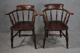 A pair of 19th century elm smoker's bow style armchairs.