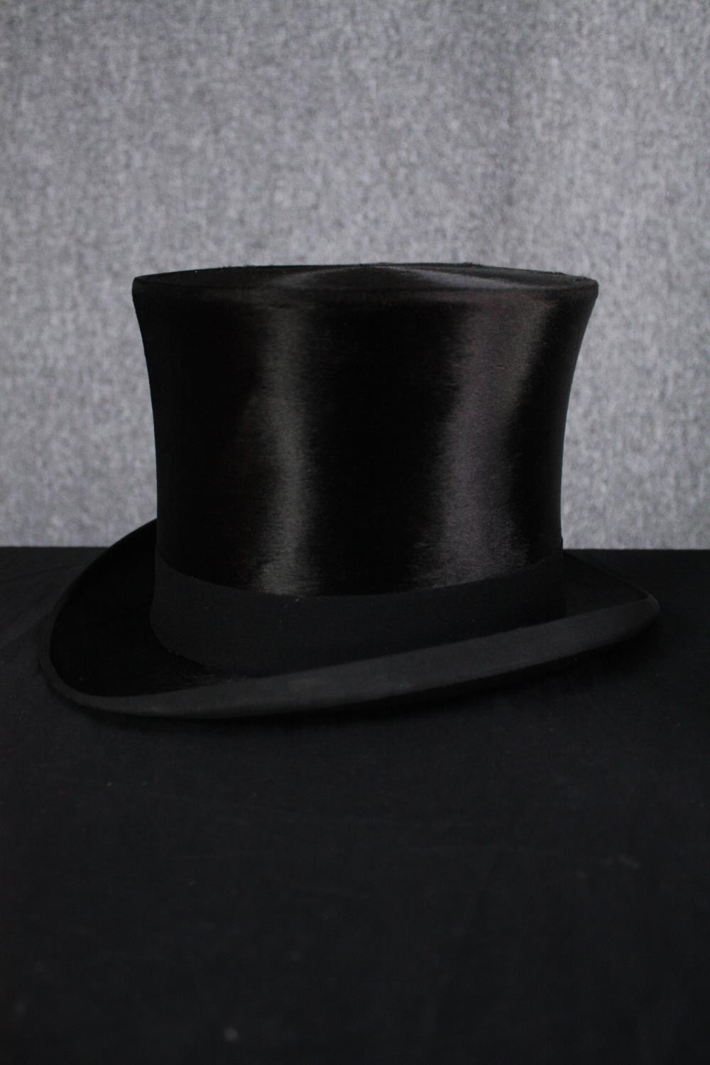 A boxed silk top hat and brush. The hat made by Karol Goeppert but with no marked size. H.20 W.34cm. - Image 2 of 4